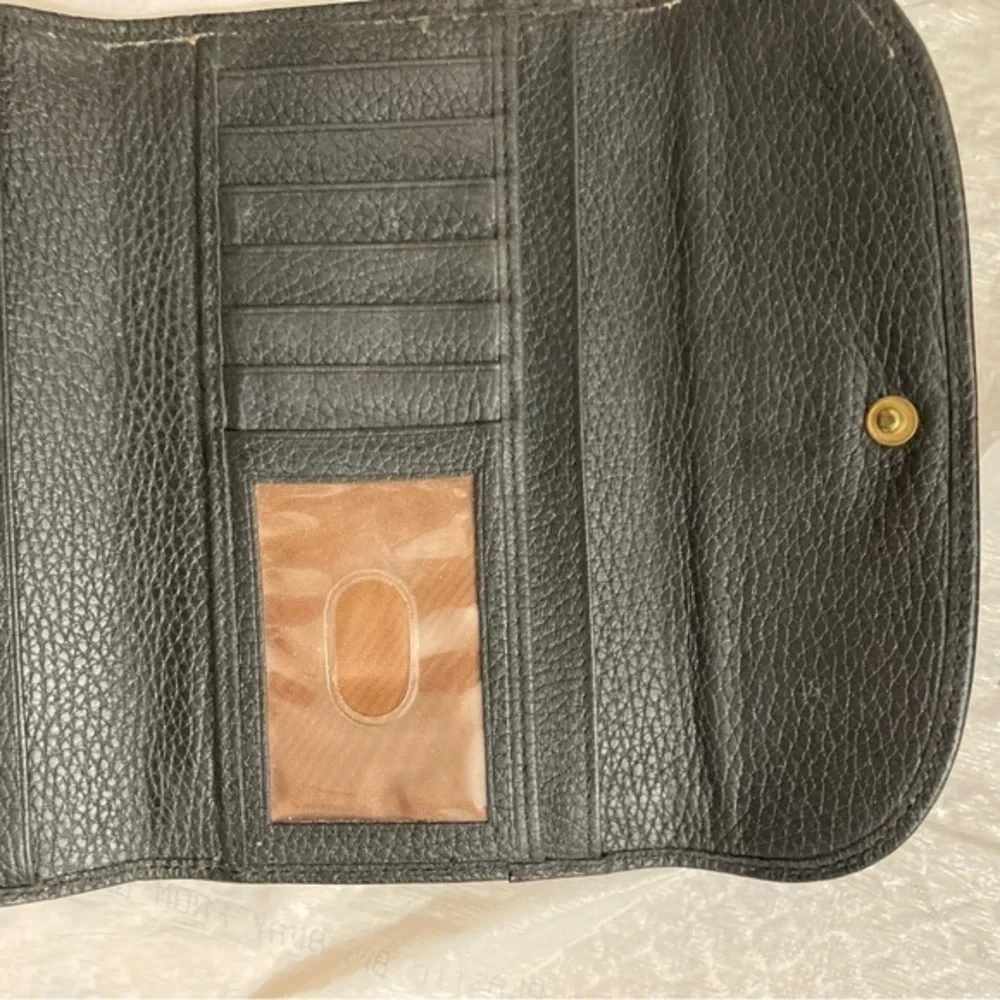 Dooney and Bourke rare perforated black pebbled leather 2 piece wallet set